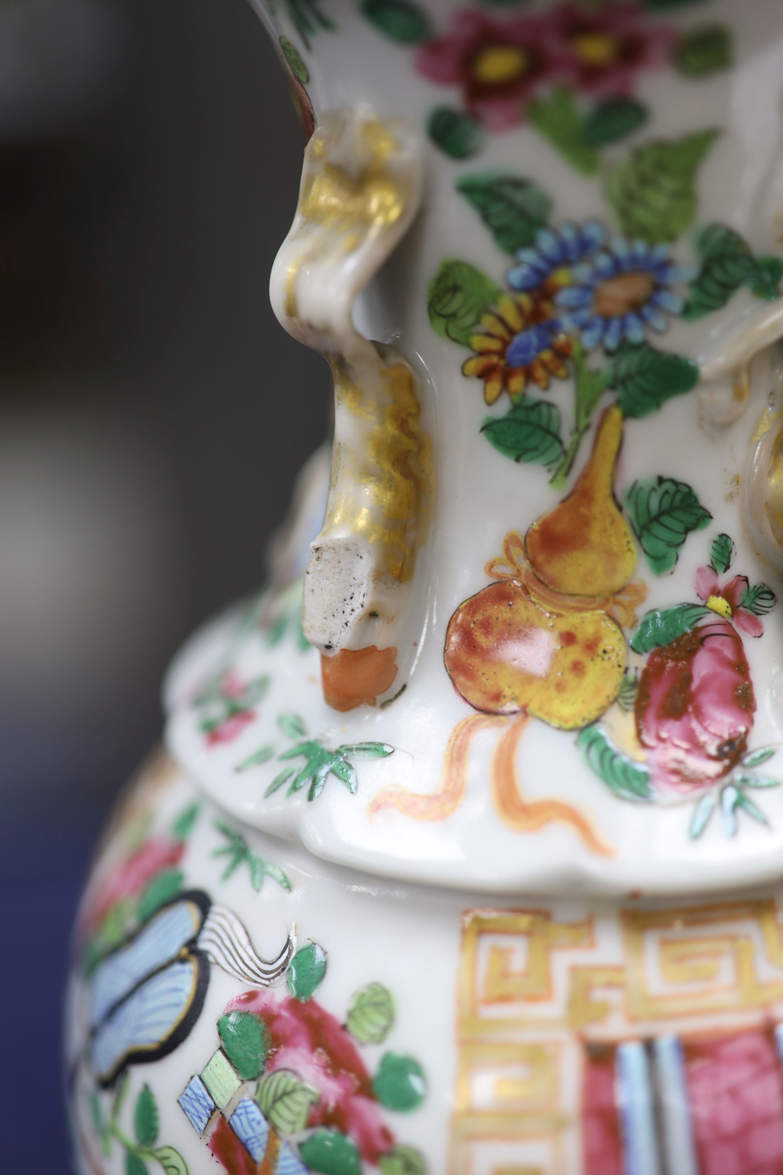 A Chinese famille verte jar and cover and a Canton famille rose vase, tallest 22cm